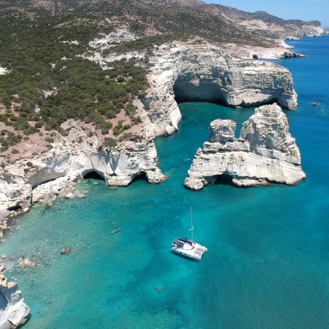 Polco Catamaran achored in a bay in Kleftiko Milos