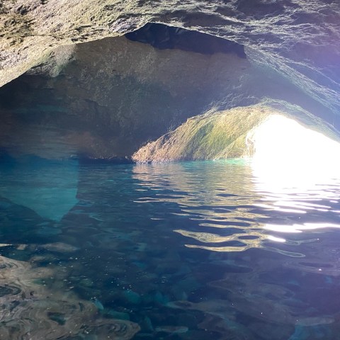a person riding a wave on top of a mountain