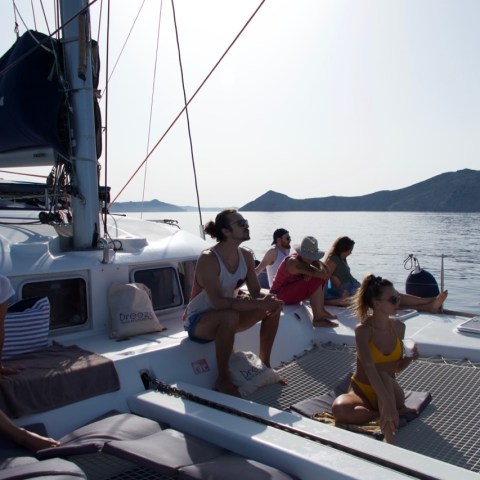 a group of people in a boat on a body of water