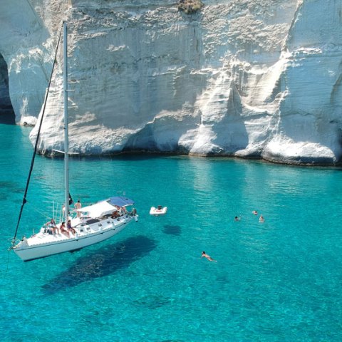 One of our sailing boats anchored in Kleftiko in crystal clear waters