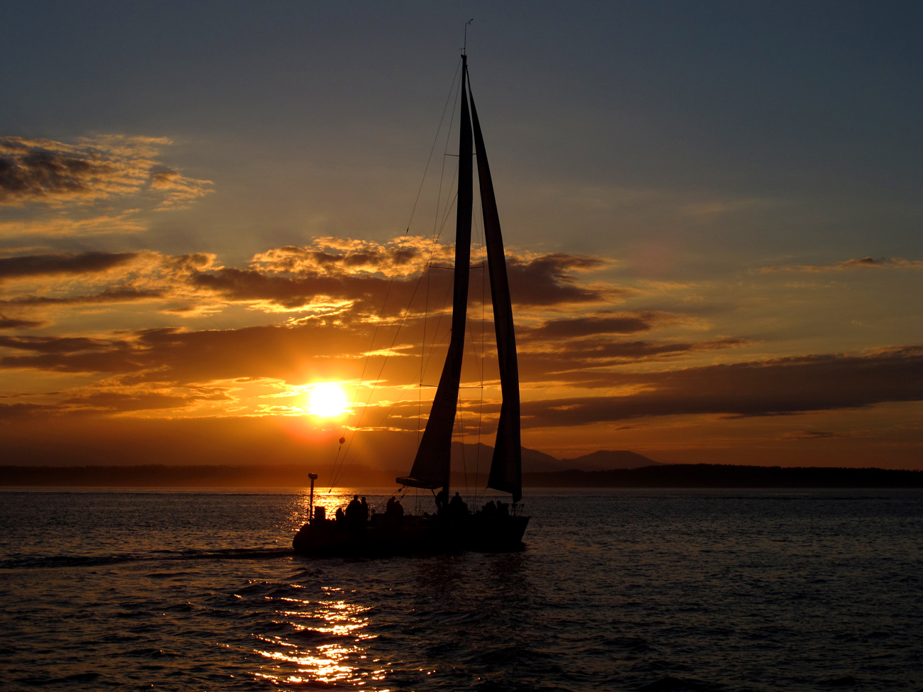 sailing boat sunset sailing into the sunset in Milos