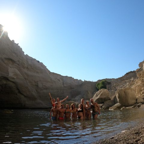 A group photo inside the cave of Sykia on a Polco sailing cruise