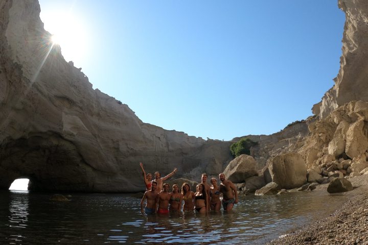 A group photo inside the cave of Sykia on a Polco sailing cruise