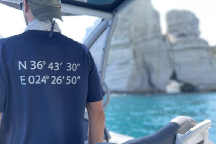 a man standing in front of a car