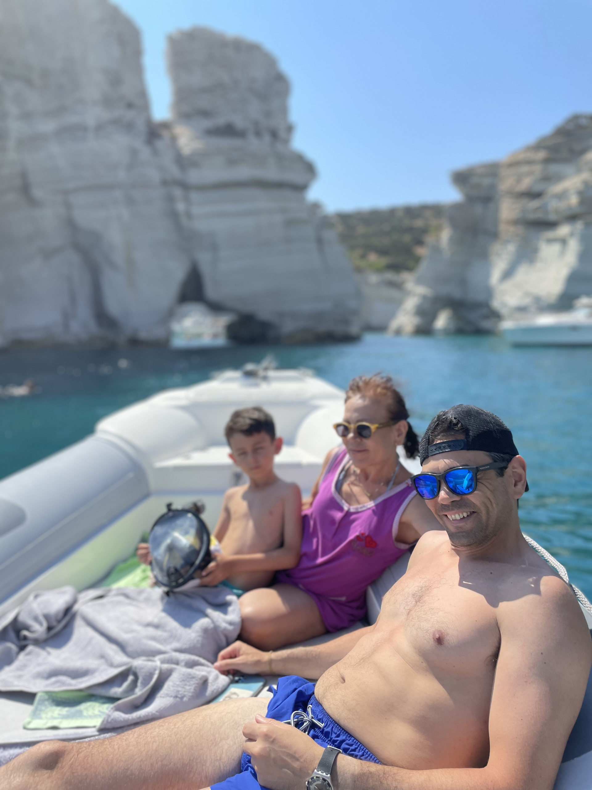 a group of people sitting at a beach
