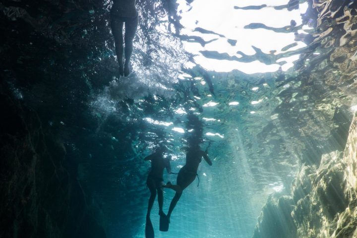 a large waterfall over some water