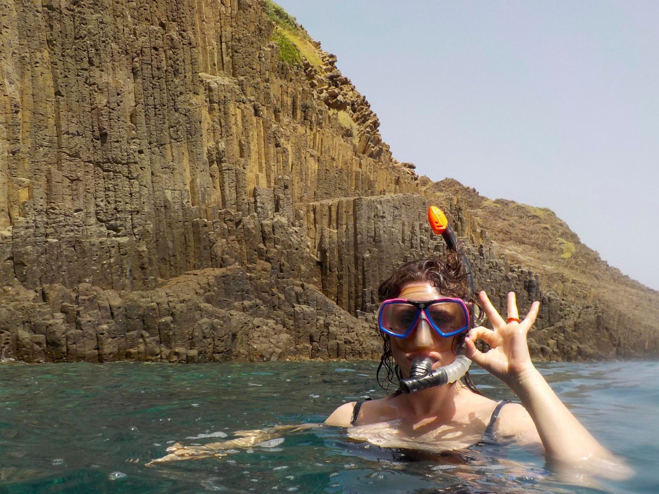 a man swimming in a body of water