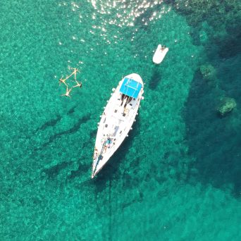 Drone photograph of our sailing boats in Kalogries, West Milos