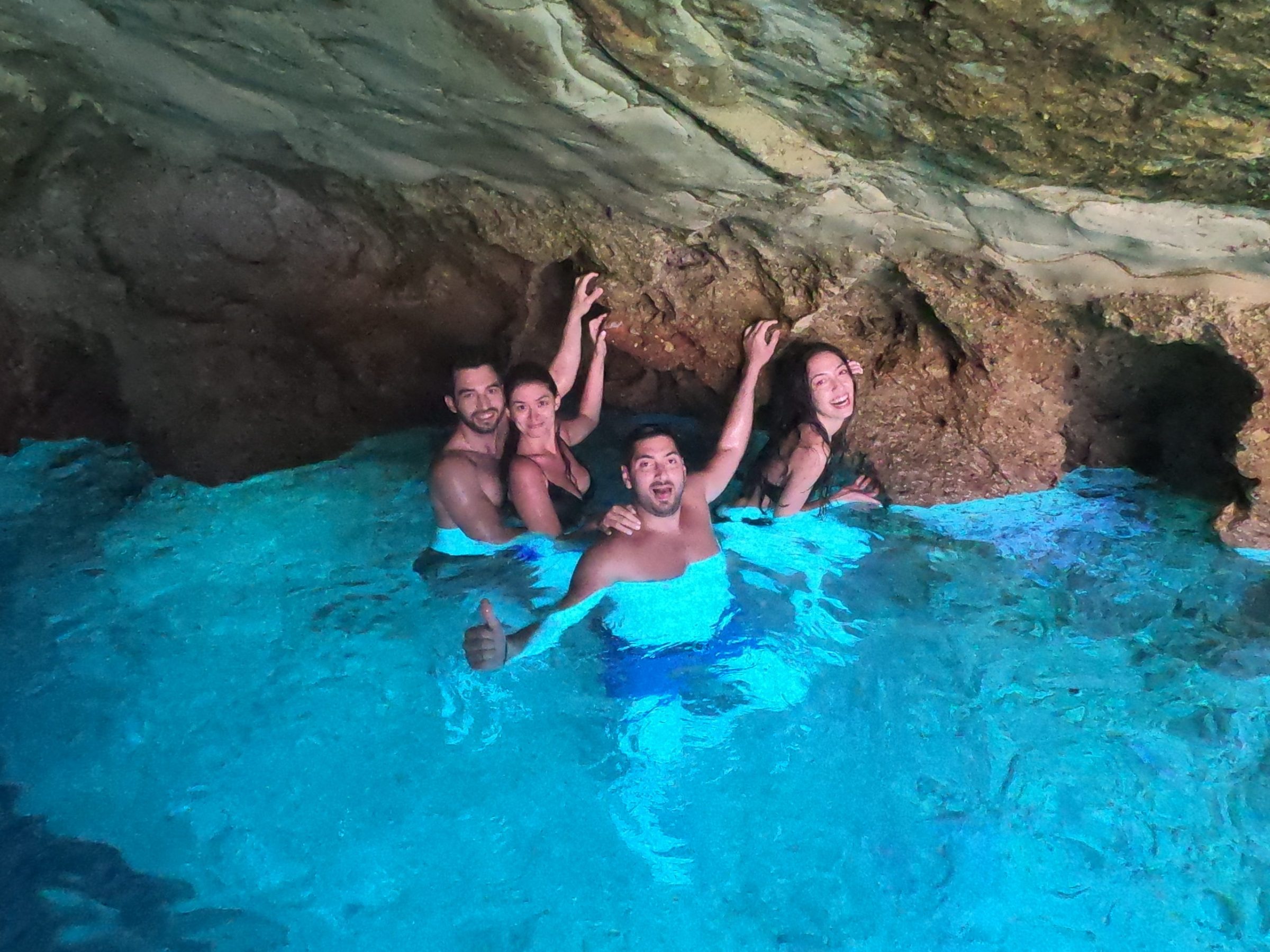 A group of friends in the Blue cave in Kleftiko