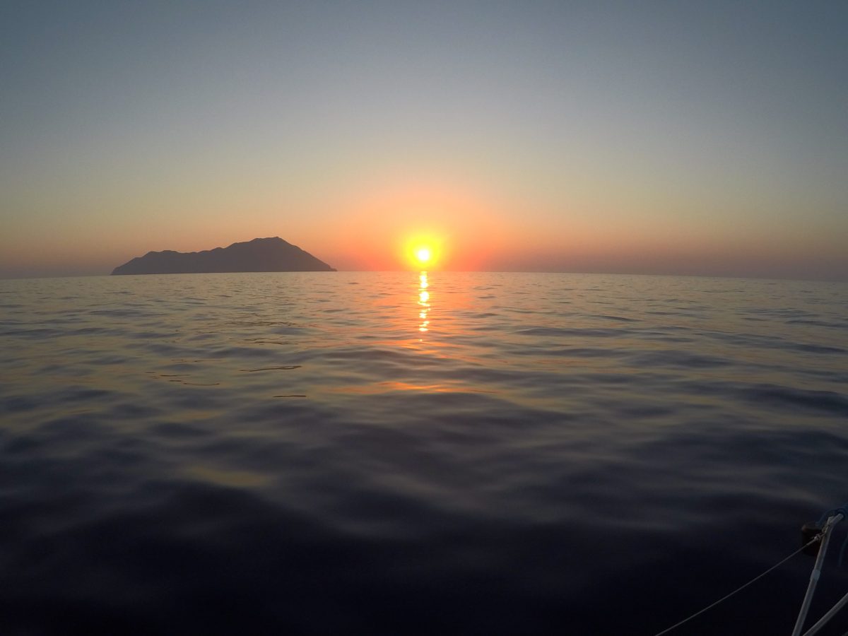 a sunset over a body of water