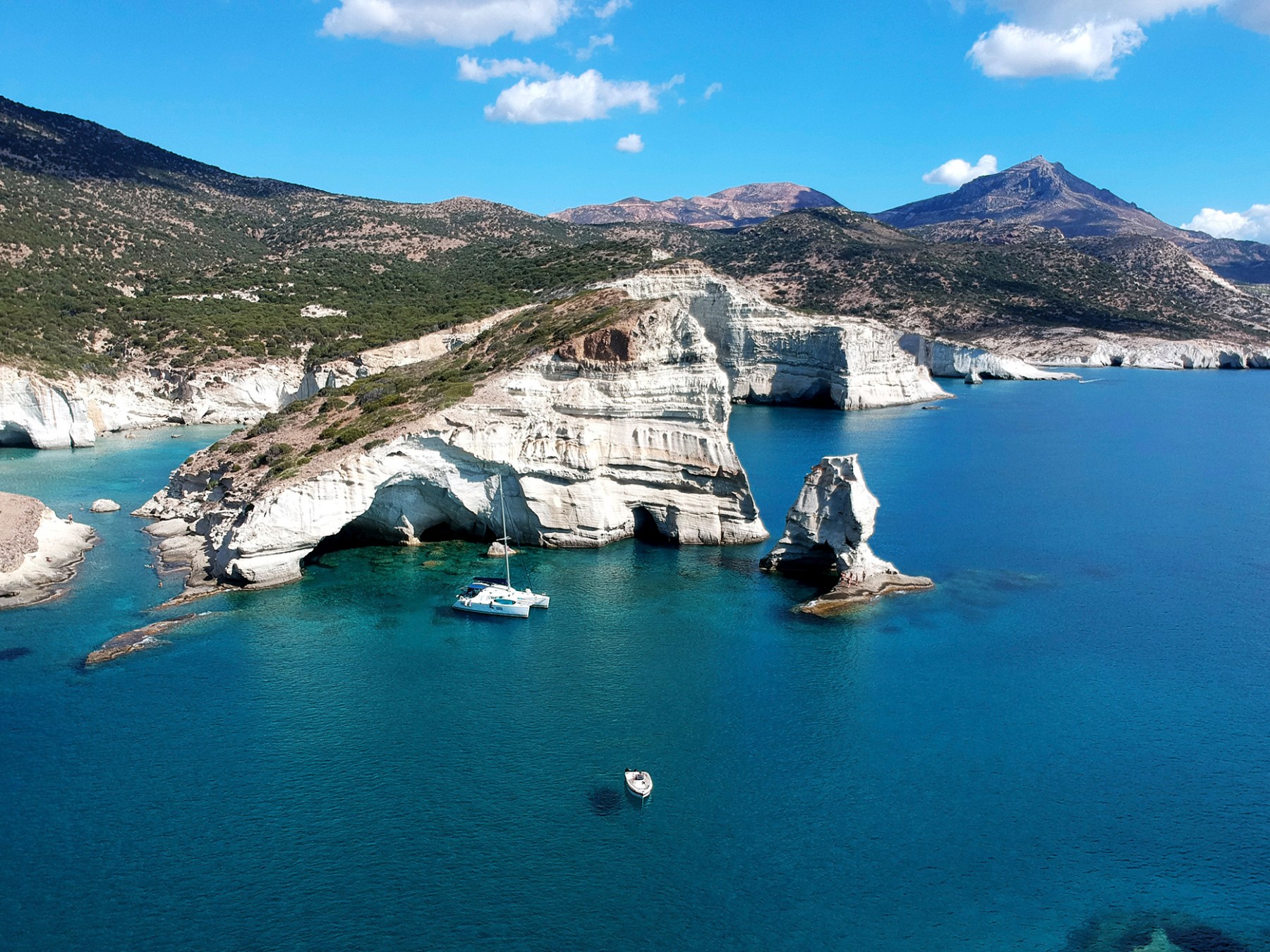 One of our drone photos of our catamaran anchored in Kleftiko, Milos